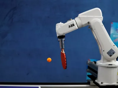 FILE PHOTO: An ABB robotic arm takes part in a table tennis competition at the inaugural World Humanoid Robot Games, at the National Speed Skating Oval in Beijing, China August 15, 2025. REUTERS/Tingshu Wang/File Photo