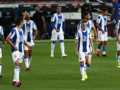 Espanyol's players during the Spanish La Liga soccer match between FC Barcelona and RCD Espanyol at the Camp Nou stadium in Barcelona, Spain, Wednesday, July 8, 2020. (AP Photo/Joan Monfort)