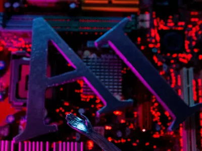 FILE PHOTO: AI (Artificial Intelligence) letters and robot hand are placed on computer motherboard in this illustration created on June 23, 2023. REUTERS/Dado Ruvic/Illustration/File Photo