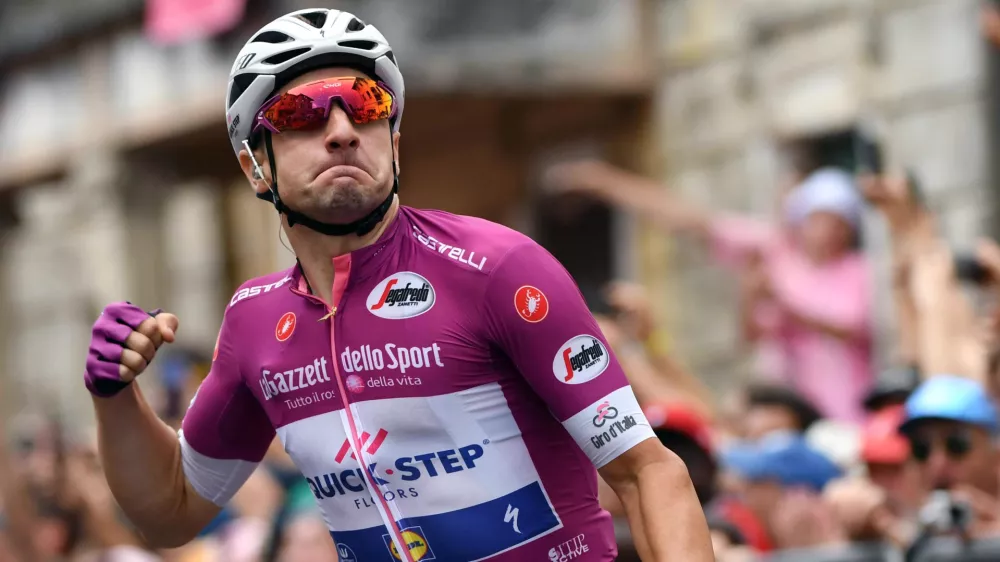 ﻿Italy's Elia Viviani celebrates as he crosses the finish line to win the 13th stage of the Giro d'Italia cycling race, from Ferrara to Nervesa della Battaglia, Italy, Friday, May 18, 2018. (Daniel Dal Zennaro/ANSA via AP)