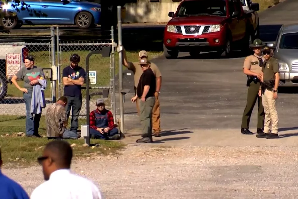 Law enforcement officers guard a gate outside the Accurate Energetic Systems military explosives plant, after an explosion at the facility in Bucksnort, Tennessee, U.S. October 10, 2025 in a still image from video. ABC Affiliate WKRN via REUTERS. NO RESALES. NO ARCHIVES. THIS IMAGE HAS BEEN SUPPLIED BY A THIRD PARTY
