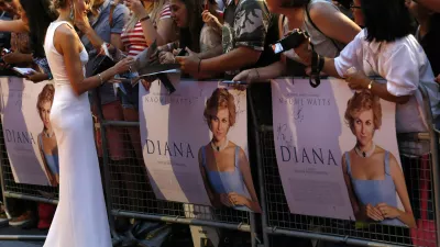 ﻿Cast member Naomi Watts of Australia, who plays the title role, signs autographs before the world premiere of "Diana" at Leicester Square in London September 5, 2013. "Diana" a biopic of the late, famed British princess, is due to open in theatres later this month.  REUTERS/Luke MacGregor (BRITAIN - Tags: ENTERTAINMENT)