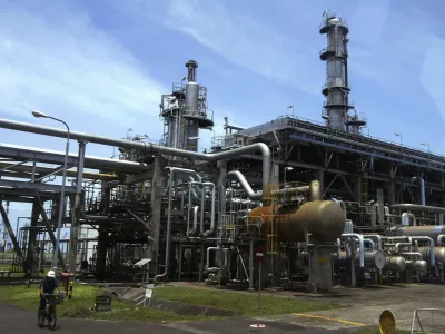 A worker cycles in the Balongan refinery belonging to Indonesia's state oil firm Pertamina in Indramayu, in West Java province March 5, 2009. Asia's top diesel importer Indonesia has asked Kuwait to cut second-quarter term supplies by nearly 80 percent, as an economic downturn and increasing use of alternative fuel erode demand, industry sources said on Thursday. State-run energy firm Pertamina sought to reduce term supplies from Kuwait Petroleum Corp (KPC) to 1.2 million barrels from 5.4 million barrels, even as the Middle East producer agreed to let Indonesia resell some committed volumes, they said. REUTERS/Dadang Tri (INDONESIA)