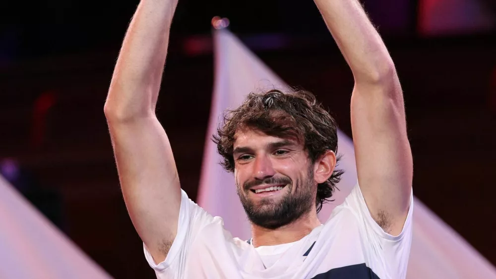 Tennis - ATP Masters 1000 - Shanghai Masters - Qizhong Forest Sports City Arena, Shanghai, China - October 12, 2025 Monaco's Valentin Vacherot celebrates with the trophy after winning the final against France's Arthur Rinderknech REUTERS/Go Nakamura