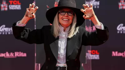 FILE PHOTO: Actor Diane Keaton shows her hands after placing them on fresh cement during a ceremony TCL Chinese theatre in Los Angeles, California, U.S., August 11, 2022. REUTERS/Mario Anzuoni/File Photo