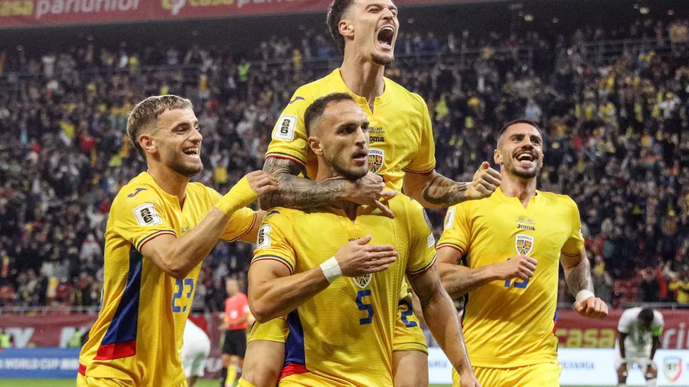 Soccer Football - FIFA World Cup - UEFA Qualifiers - Group H - Romania v Austria - Arena Nationala, Bucharest, Romania - October 12, 2025 Romania's Virgil Ghita celebrates scoring their first goal with teammates Inquam Photos via REUTERS/Bogdan Buda ROMANIA OUT. NO COMMERCIAL OR EDITORIAL SALES IN ROMANIA. THIS IMAGE HAS BEEN SUPPLIED BY A THIRD PARTY.