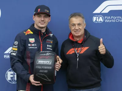 Red Bull Racing driver Max Verstappen, left, who won the pole, stands with former Formula One driver Jean Alesi following qualifying for Canadian Grand Prix auto race Saturday, June 17, 2023, in Montreal. (Paul Chiasson/The Canadian Press via AP)