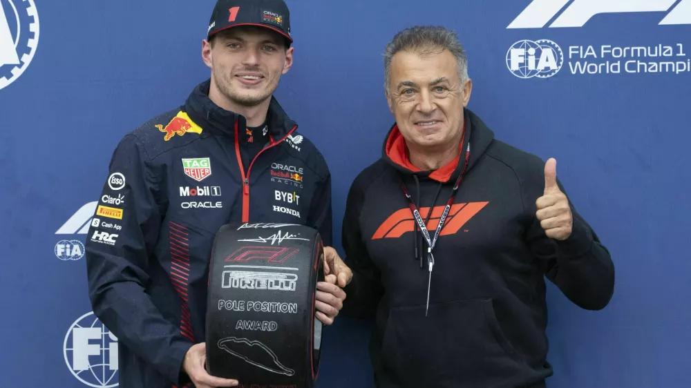 Red Bull Racing driver Max Verstappen, left, who won the pole, stands with former Formula One driver Jean Alesi following qualifying for Canadian Grand Prix auto race Saturday, June 17, 2023, in Montreal. (Paul Chiasson/The Canadian Press via AP)