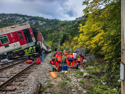 In this photo released by Slovak Police, rescue workers treat wounded passengers after a train crash near Roznava, Slovakia, Monday, Oct. 13, 2025. (Slovak Police via AP)