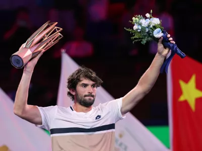 Tennis - ATP Masters 1000 - Shanghai Masters - Qizhong Forest Sports City Arena, Shanghai, China - October 12, 2025 Monaco's Valentin Vacherot celebrates with the trophy after winning the final against France's Arthur Rinderknech REUTERS/Go Nakamura