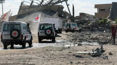 Red Cross vehicles escort a truck transporting the bodies of Palestinians who had been held in Israel during the war, amid a ceasefire between Israel and Hamas, in Khan Younis in the southern Gaza Strip, October 14, 2025. REUTERS/Ramadan Abed   TPX IMAGES OF THE DAY