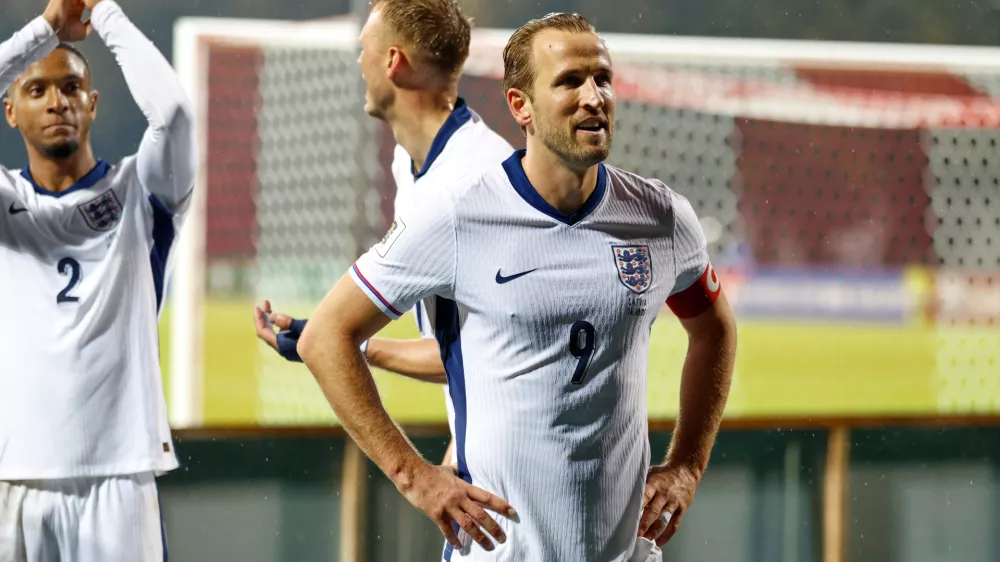 England's Harry Kane greets England's travelling support after the 2026 World Cup group K qualifying soccer match between Latvia and England in Riga, Latvia, Tuesday, Oct. 14, 2025. (AP Photo/Mindaugas Kulbis)