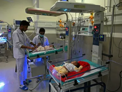 In this photograph taken on October 13, 2022, newborn babies lay on radiant warmers inside a special newborn care unit at a hospital in Amritsar. India is projected to see an explosion in its urban population in the coming decades, but its cities already cannot cope and climate change will make living conditions harsher still.,Image: 735878016, License: Rights-managed, Restrictions: To go with 'India-Population-Climate-Health', FOCUS, Model Release: no