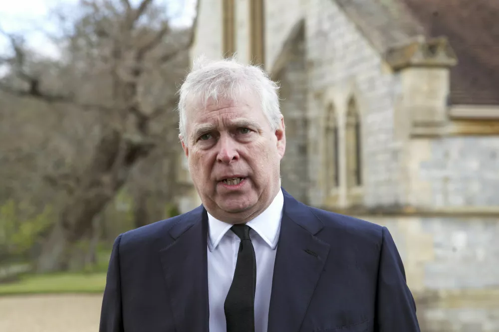 ﻿FILE - Britain's Prince Andrew speaks during a television interview at the Royal Chapel of All Saints at Royal Lodge, Windsor, April 11, 2021.  Prince Andrew has agreed to settle a lawsuit filed by Virginia Giuffre, who said she was sexually trafficked to the British royal by the financier Jeffrey Epstein when she was 17. The deal described in a court filing Tuesday, Feb. 15, 2022, in New York avoids a trial that would have brought further embarrassment to the monarchy. (Steve Parsons/Pool Photo via AP, File)