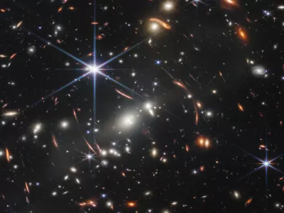 HANDOUT - 12 July 2022, ---, -: An image provided by NASA on 12 July 2022 shows the galaxy cluster SMACS 0723, captured by James Webb Space Telescope. The first image from NASA's new space telescope shows the deepest and sharpest image of the distant universe to date. The image known as Webb's First Deep Field shows galaxy cluster SMACS 0723 and is overflowing with detail. Photo: Space Telescope Science Institut/NASA/ESA/CSA/dpa - ATTENTION: editorial use only and only if the credit mentioned above is referenced in full