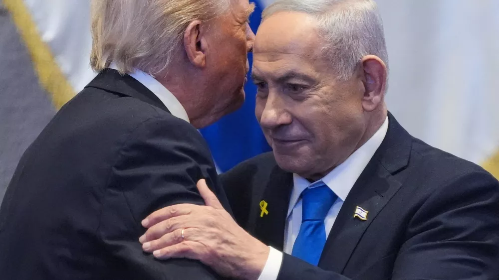FILE PHOTO: President Donald Trump talks with Israel's Prime Minister Benjamin Netanyahu at the Knesset, Monday, Oct. 13, 2025, in Jerusalem.   Evan Vucci/Pool via REUTERS/File Photo