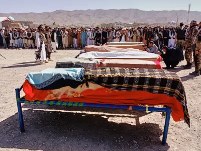 The bodies of victims of a Pakistani cross-border airstrike, including three local cricketers, are prepared for their funeral in the village of Khandaro in the Argun district of Afghanistan's eastern Paktika province, Saturday, Oct. 18, 2025. (AP Photo/Shafiqullah Mashaal)
