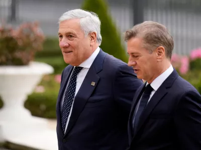 Slovenian Prime Minister Robert Golob welcomes Italy's Foreign Minister Antonio Tajani, left, as he arrives for the summit of the informal MED9 group of the nine like-minded Mediterranean EU Member States, in Portoroz, Slovenia, Monday, Oct. 20, 2025. (AP Photo/Darko Bandic)