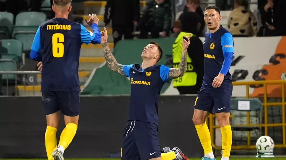 Celje's Franko Kovacevic, center, celebrates scoring during the Conference League soccer match between Shamrock Rovers and Celje in Dublin, Ireland, Thursday Oct. 23, 2025. (Brian Lawless/PA via AP)