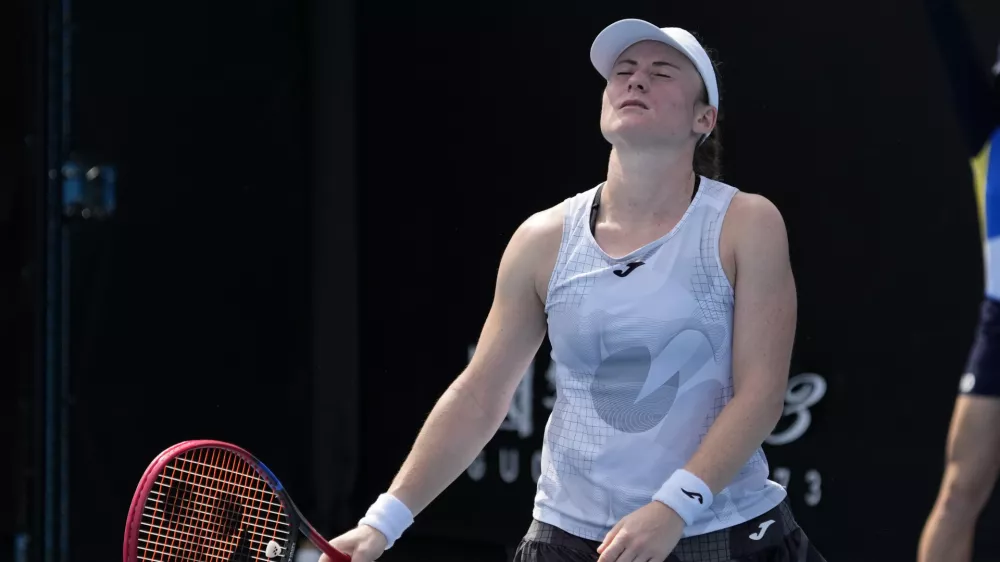 Tamara Zidansek of Slovenia reacts during her first round match against Anastasia Potapova of Russia at the Australian Open tennis championship in Melbourne, Australia, Monday, Jan. 13, 2025. (AP Photo/Manish Swarup)
