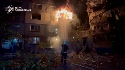 A firefighter works at the site of a Russian strike, amid Russia's attack on Ukraine, in a location given as Zaporizhzhia, Ukraine, in this screengrab from a video released on October 22, 2025. State Emergency Service Of Ukraine In Zaporizhzhia Region/Handout via REUTERS  THIS IMAGE HAS BEEN SUPPLIED BY A THIRD PARTY. MANDATORY CREDIT. VERIFICATION: Reuters was not able to independently verify the location or the date when the footage was filmed.