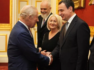 Britain's King Charles III greets the Prime Minister of the Republic of Kosovo Albin Kurti, during a reception for Western Balkans leaders at St James's Palace, London, Tuesday, Oct. 21, 2025, on the eve of the Western Balkans Leaders' Summit. (Aaron Chown/Pool Photo via AP)