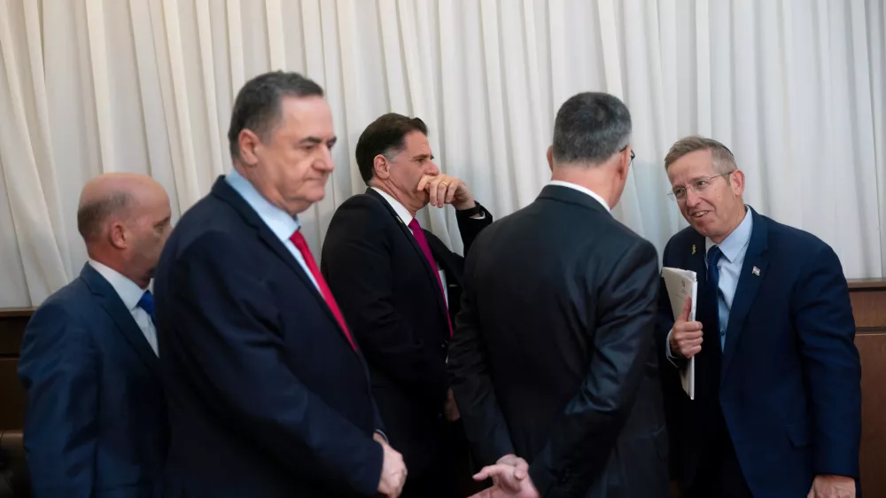 Members of Israeli Prime Minister Benjamin Netanyahu's government including Minister of Defense Israel Katz and Cabinet Secretary Yossi Fuchs speak before a meeting between U.S. Vice President JD Vance and Prime Minister Netanyahu at the Prime Minister's Office in Jerusalem, Wednesday, Oct. 22, 2025. (Nathan Howard/The New York Times via AP, Pool)
