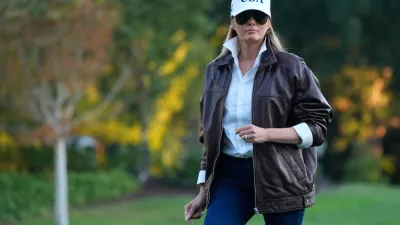 First lady Melania Trump walks toward the residence after arriving on the South Lawn of the White House on Marine One with President Donald Trump Sunday, Oct. 5, 2025, in Washington. (AP Photo/Manuel Balce Ceneta)