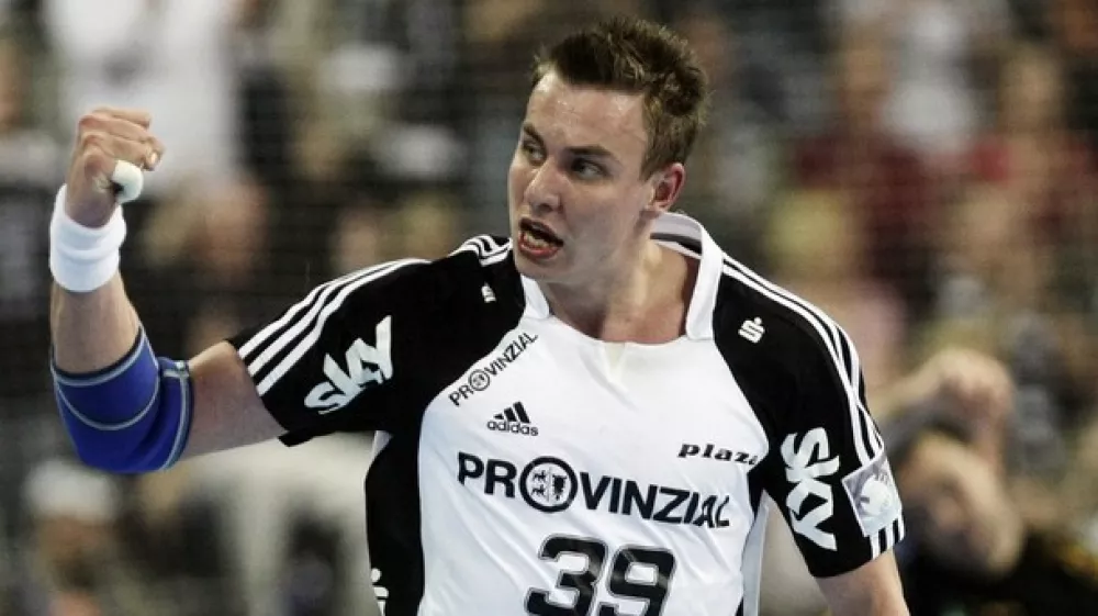 THW Kiel's Filip Jicha celebrates scoring during the first-leg EHF Champions League semi-final match in the northern German city of Kiel on April 26, 2009. THW Kiel won the match 37-23. AFP PHOTO DDP / ROLAND MAGUNIA GERMANY OUT (Photo credit should read ROLAND MAGUNIA/AFP/Getty Images)
