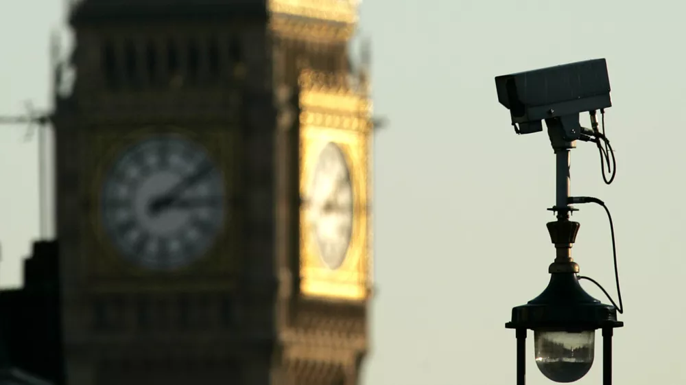 A CCTV (Closed Circuit Television) camera is seen with the backdrop of Big Ben in central London, Thursday, Nov. 2, 2006. Demand is growing for a debate on the number of CCTV cameras in Britain as figures reveal that 20% of the world's spy cameras are in the UK - one for every 12 people. It makes Britons the most spied on people anywhere on the globe. British Information commissioner Richard Thomas has warned the UK is in danger of turning into a Big Brother society. He says more and more personal data is being collected on all of us by the state and big business. (AP Photo / Akira Suemori)