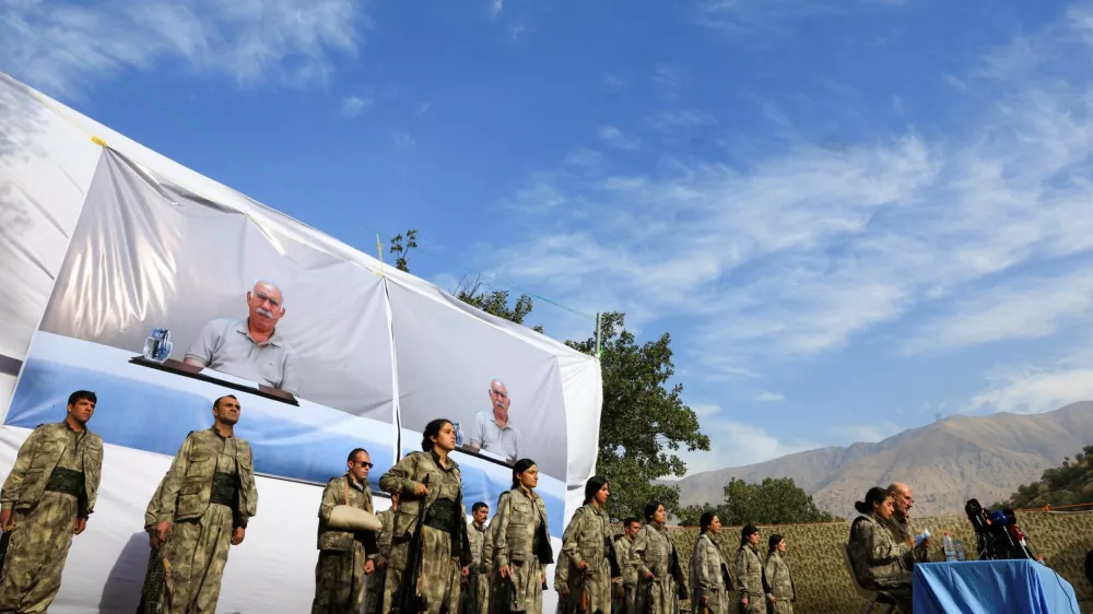 Fighters with the Kurdistan Workers' Party (PKK) line up during a disarmament ceremony marking a significant step toward ending the decades-long conflict between Turkey and the outlawed group in Qandil mountains, Iraq October 26, 2025. REUTERS/Thaier Al-Sudani
