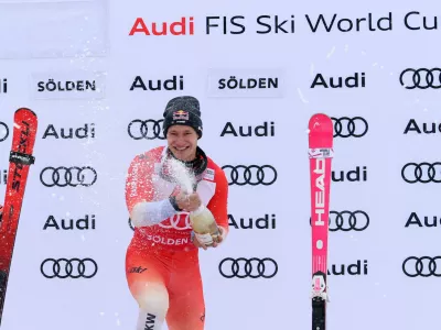 Alpine Skiing - FIS Alpine Ski World Cup - Men's Giant Slalom - Soelden, Austria - October 26, 2025 Switzerland's Marco Odermatt celebrates on the podium with champagne after placing first REUTERS/Leonhard Foeger
