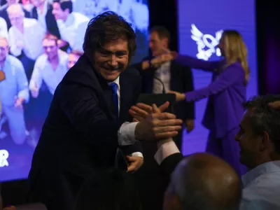 Argentina's President Javier Milei reacts as he greets people after the La Libertad Avanza party won the midterm election, which is seen as crucial for Milei's administration after U.S. President Donald Trump warned that future support for Argentina would depend on Milei's party performing well in the vote, in Buenos Aires, Argentina, October 26, 2025. REUTERS/Cristina Sille