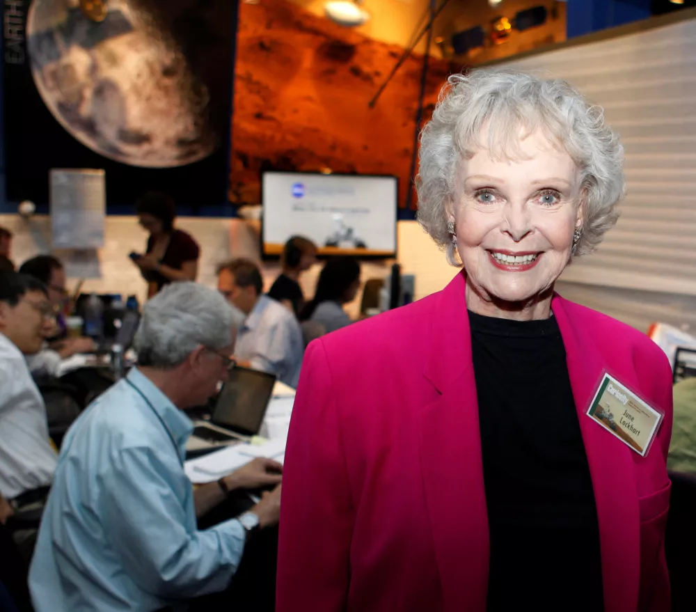 FILE PHOTO: Actress June Lockhart, best know for her TV roles in "Lost in Space" and "Lassie", poses for a photograph in the newsroom at NASA's Jet Propulsion Lab in Pasadena, Calfiornia August 5, 2012. REUTERS/Fred Prouser/File Photo