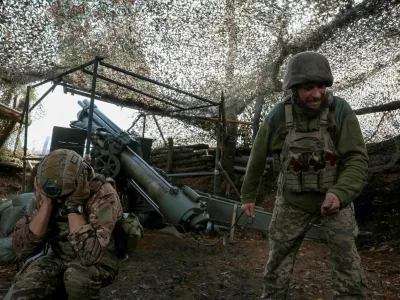 FILE PHOTO: Artillerymen of the 152nd Separate Jaeger Brigade fire an M114 self-propelled howitzer towards Russian troops, amid Russia's attack on Ukraine, near the frontline town of Pokrovsk in Donetsk region, Ukraine October 15, 2025. REUTERS/Anatolii Stepanov/File Photo
