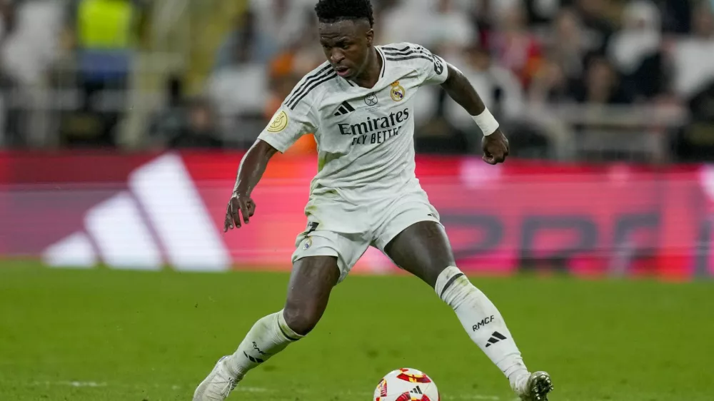 Real Madrid's Vinicius Junior is in action during the Spanish Super Cup semifinal soccer match between Real Madrid and Mallorca at the King Abdullah Stadium in Jeddah, Saudi Arabia, Thursday, Jan. 9, 2025. (AP Photo/Altaf Qadri)
