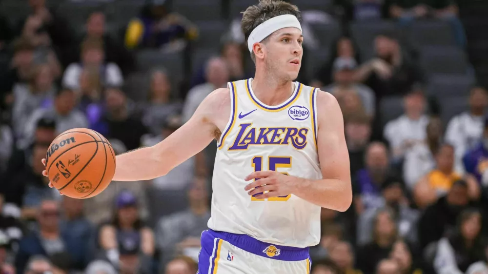 Oct 26, 2025; Sacramento, California, USA; Los Angeles Lakers guard Austin Reaves (15) controls the ball against the Sacramento Kings during the second quarter at Golden 1 Center. Mandatory Credit: Ed Szczepanski-Imagn Images