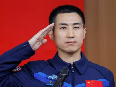 Astronaut Wu Fei salutes during a press conference before the Shenzhou-21 spaceflight mission to China's Tiangong space station, at Jiuquan Satellite Launch Center, near Jiuquan, Gansu province, China, October 30, 2025. REUTERS/Maxim Shemetov