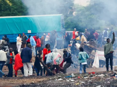 SENSITIVE MATERIAL. THIS IMAGE MAY OFFEND OR DISTURB  Demonstrators carry the dead body of a man killed during a protest a day after a general election marred by violent demonstrations over the exclusion of two leading opposition candidates at the Namanga One-Post Border crossing point between Kenya and Tanzania, as seen from Namanga, Kenya October 30, 2025. REUTERS/Thomas Mukoya   TPX IMAGES OF THE DAY