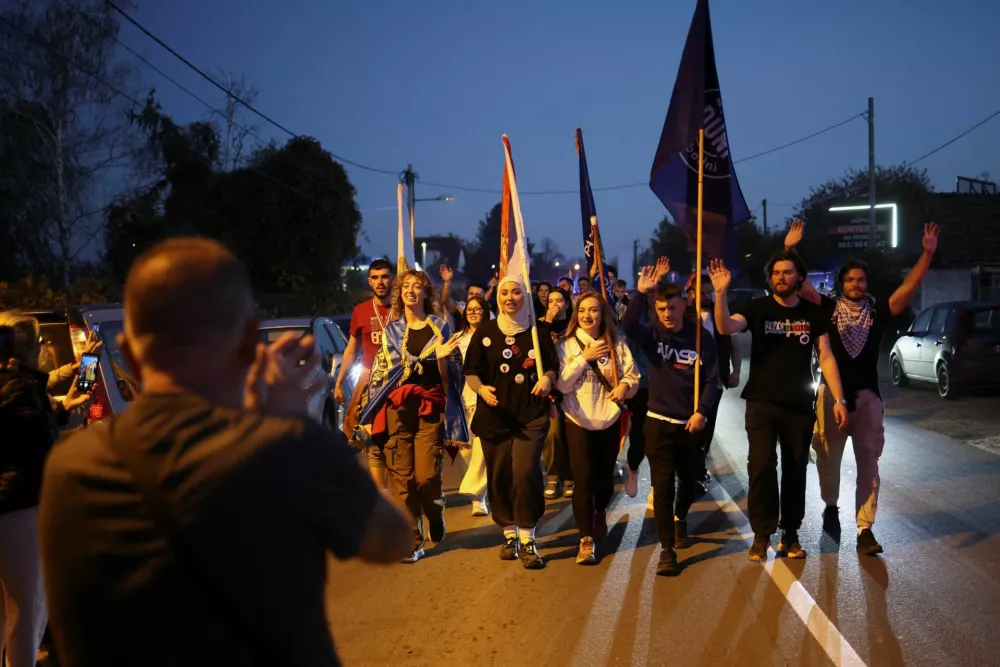 Students are welcomed by local people during a protest march marking the first anniversary of the fatal November 2024 Novi Sad railway station canopy collapse, which killed 16 people, triggering nationwide accusations of widespread corruption and negligence, in Petrovaradin, near Novi Sad, Serbia, October 31, 2025. REUTERS/Marko Djurika