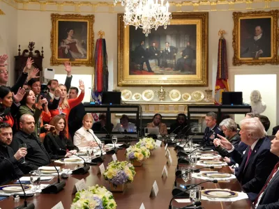 President Donald Trump, second right, and Ukraine's President Volodymyr Zelenskyy, seated left, sit as reporters ask questions before a lunch in the Cabinet Room of the White House, Friday, Oct. 17, 2025, in Washington. (AP Photo/Alex Brandon)