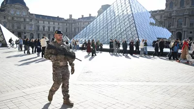 A soldier patrols in courtyard of the Louvre museum, Thursday, Oct. 30, 2025 in Paris. (AP Photo/Emma Da Silva)