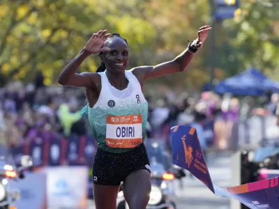 Athletics - 2025 TCS New York City Marathon - New York City, New York, U.S. - November 2, 2025 Kenya's Hellen Obiri crosses the line to win the women's elite race REUTERS/Eduardo Munoz