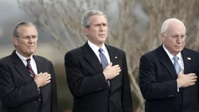 U.S. President George W. Bush, Vice President Dick Cheney (R) and outgoing Secretary of Defense Donald Rumsfeld (L) place their hands over their hearts as the national anthem is played at Rumsfeld's farewell tribute at the Pentagon in Arlington, Virginia, December 15, 2006. Rumsfeld will be replaced by former CIA director Robert Gates.  REUTERS/Kevin Lamarque (UNITED STATES)