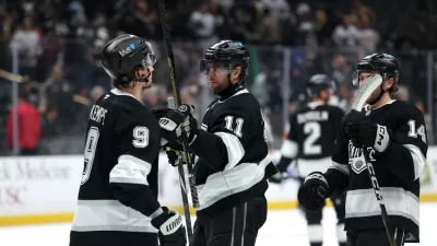 Nov 4, 2025; Los Angeles, California, USA; Los Angeles Kings center Anze Kopitar (11) celebrates a win with right wing Adrian Kempe (9) after defeating the Winnipeg Jets 3-0 at Crypto.com Arena. Mandatory Credit: Kiyoshi Mio-Imagn Images