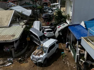 A drone view shows cars piled up after being swept away in floods brought by Typhoon Kalmaegi pile up at a subdivision in Bacayan, Cebu City, Philippines, November 5, 2025. REUTERS/Eloisa Lopez