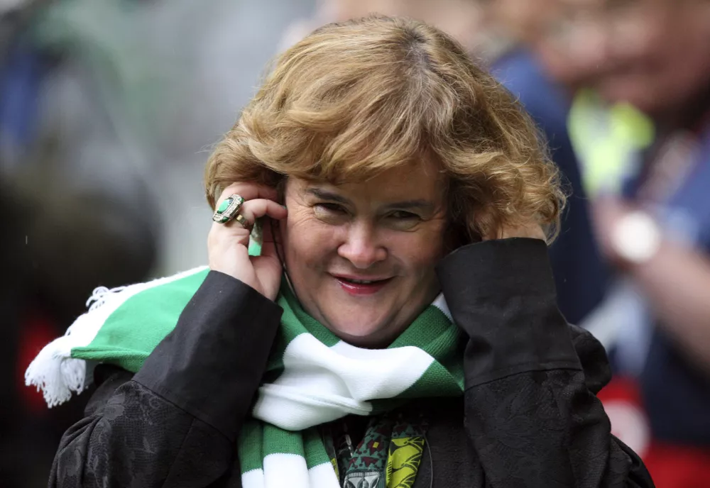 Susan Boyle performs ahead of the Champions League qualifying second round soccer match between Celtic and Helsingborgs at Celtic Park, Glasgow, Scotland, Wednesday, Aug. 29, 2012. (AP Photo/Scott Heppell)