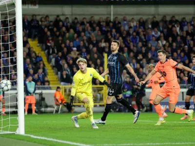 Soccer Football - UEFA Champions League - Club Brugge v FC Barcelona - Jan Breydel Stadium, Bruges, Belgium - November 5, 2025 Club Brugge's Christos Tzolis scores FC Barcelona's third with an own goal REUTERS/Yves Herman
