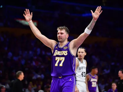 Nov 5, 2025; Los Angeles, California, USA; Los Angeles Lakers guard Luka Doncic (77) reacts after scoring a basket against the San Antonio Spurs during the first half at Crypto.com Arena. Mandatory Credit: Gary A. Vasquez-Imagn Images