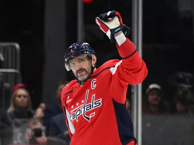 Washington Capitals left wing Alex Ovechkin (8) celebrates his 900th career NHL goal during the second period of an NHL hockey game against the St. Louis Blues, Wednesday, Nov. 5, 2025, in Washington. (AP Photo/Nick Wass)